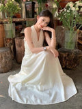 French Hanging Neck V-Neck Sleeveless Dress Women's Summer 2026 New Temperament To Receive The Waist Thin Hourglass Waist Long Skirt